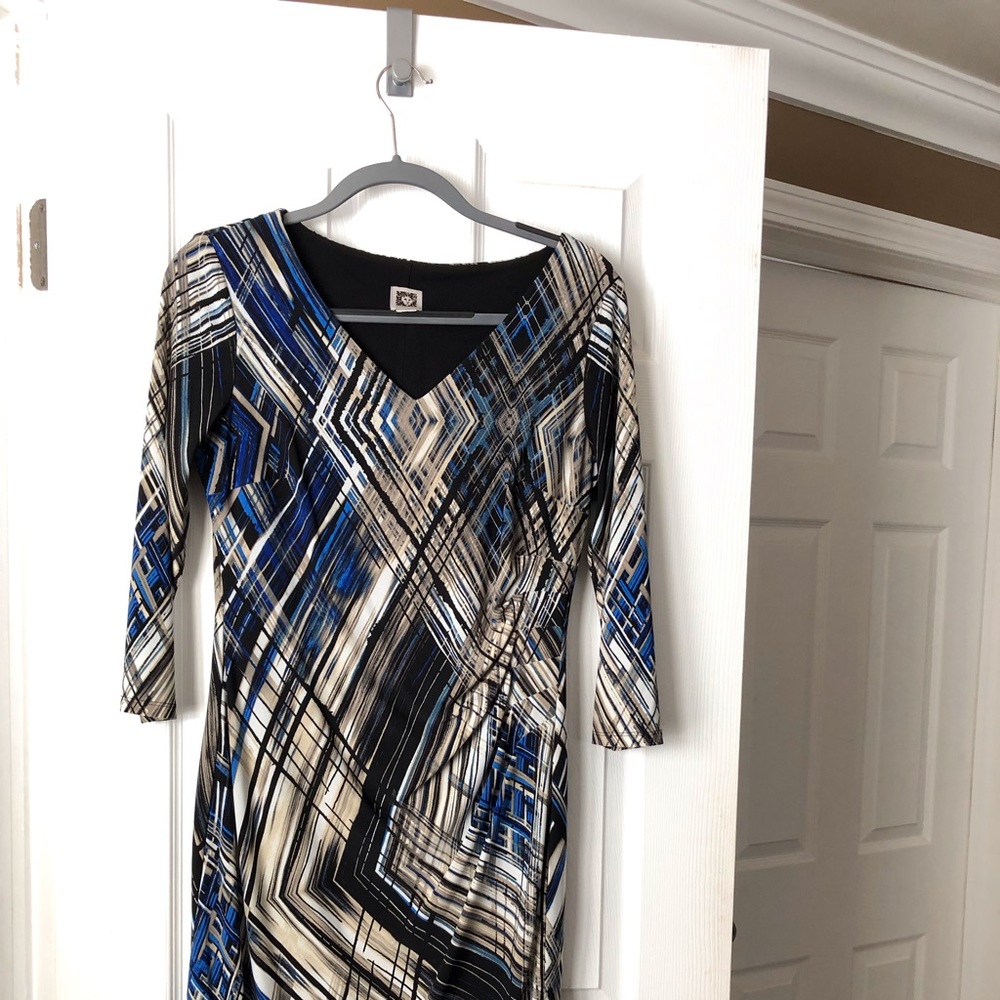 Multi-color, long sleeve dress.